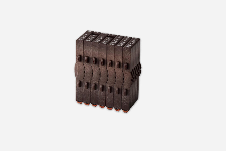 Rubber Stamp Perpetual Calendar. A rotary date stamp with adjustable weekday and number bands, dark brown color.